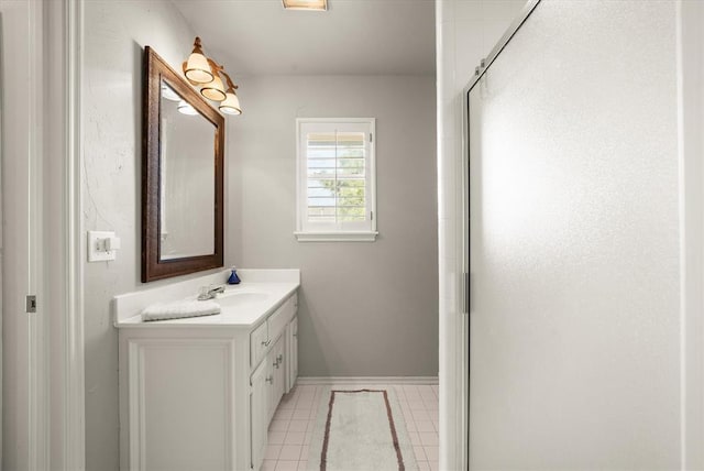 2817 Sweetbriar Way, Edmond, OK 73034 - full bath featuring vanity, tile patterned flooring, a shower with shower door, and baseboards