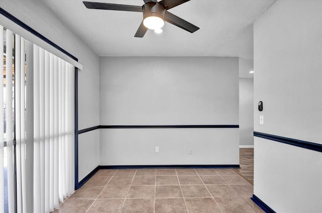 665 NW 15th St, Moore, OK 73160 - spare room featuring ceiling fan, light tile patterned floors, and healthy amount of natural light