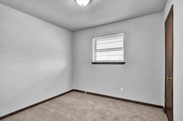 665 NW 15th St, Moore, OK 73160 - unfurnished room featuring carpet flooring and a textured ceiling