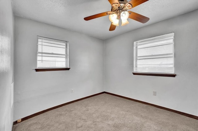 665 NW 15th St, Moore, OK 73160 - empty room featuring carpet, ceiling fan, and a textured ceiling