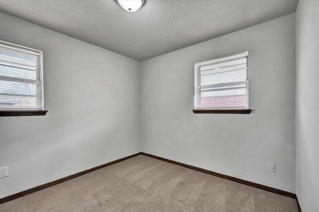 665 NW 15th St, Moore, OK 73160 - unfurnished room with a textured ceiling and light colored carpet