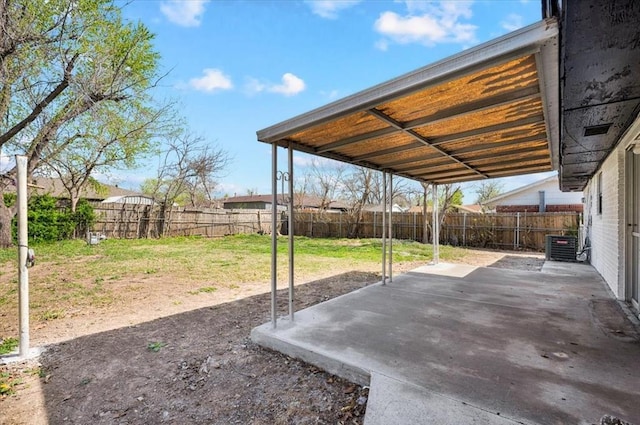 665 NW 15th St, Moore, OK 73160 - fenced backyard featuring a patio area