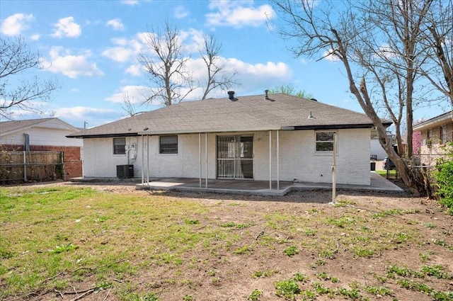 665 NW 15th St, Moore, OK 73160 - back of house with a patio and brick siding