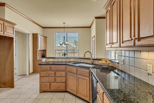 5405 NW 122nd Ter, Oklahoma City, OK 73162 - kitchen with a sink, a chandelier, crown molding, light tile patterned floors, and dark stone countertops