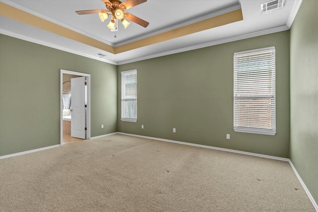 5405 NW 122nd Ter, Oklahoma City, OK 73162 - spare room featuring a tray ceiling, ornamental molding, ceiling fan, carpet flooring, and baseboards