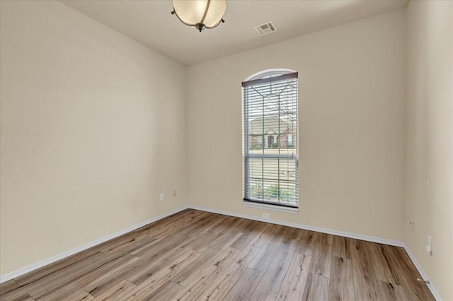 5405 NW 122nd Ter, Oklahoma City, OK 73162 - spare room with wood finished floors and baseboards