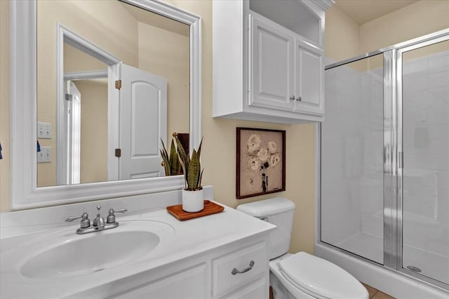 5405 NW 122nd Ter, Oklahoma City, OK 73162 - bathroom featuring a stall shower, toilet, and vanity