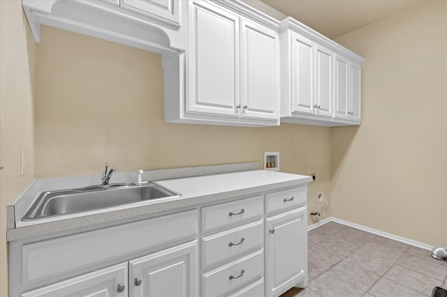 5405 NW 122nd Ter, Oklahoma City, OK 73162 - washroom with cabinet space, washer hookup, baseboards, light tile patterned flooring, and gas dryer hookup