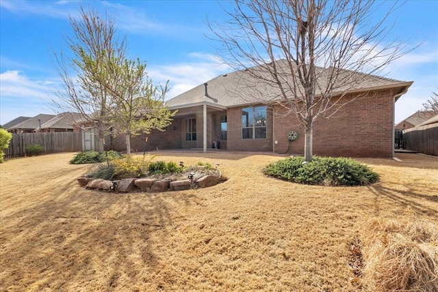 5405 NW 122nd Ter, Oklahoma City, OK 73162 - rear view of property with a patio area and brick siding