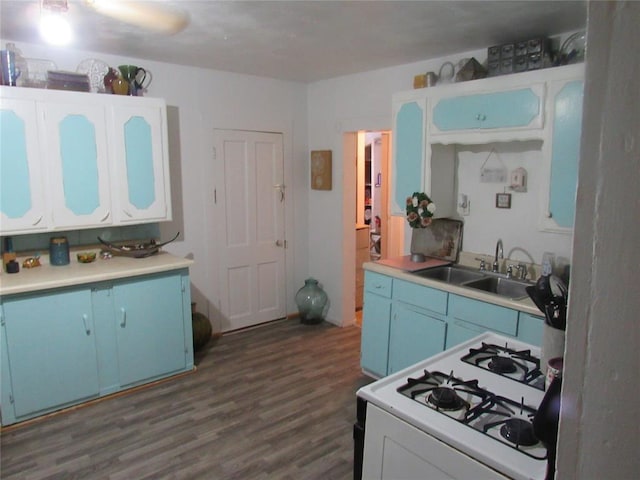 110 S Cherry, Paoli, OK 73074 - kitchen with blue cabinetry, a sink, white range with gas cooktop, and dark wood-type flooring