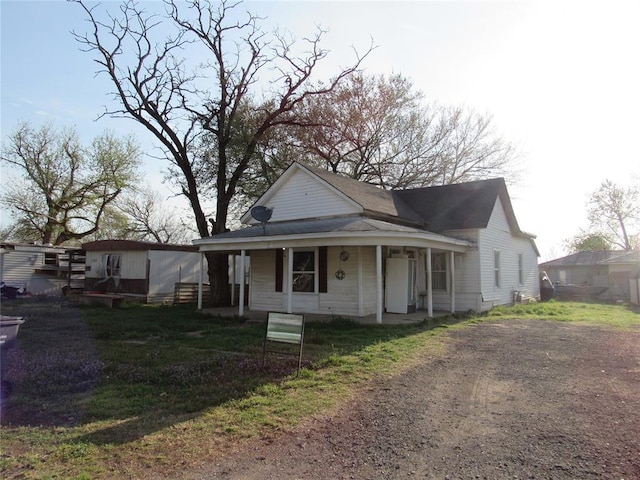 110 S Cherry, Paoli, OK 73074 - view of front of house featuring a front lawn and a porch