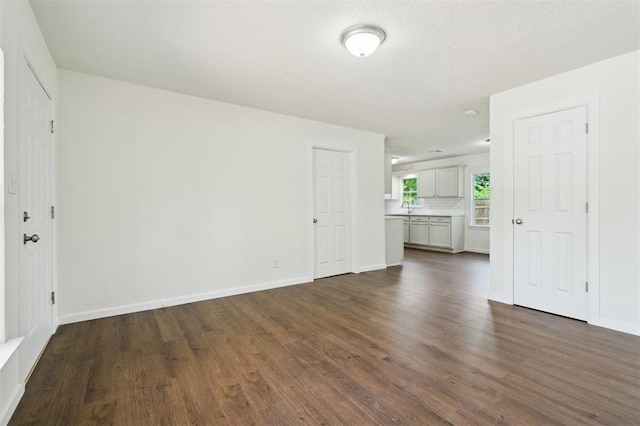 2233 SW 40th St, Oklahoma City, OK 73119 - empty room featuring dark wood finished floors and baseboards