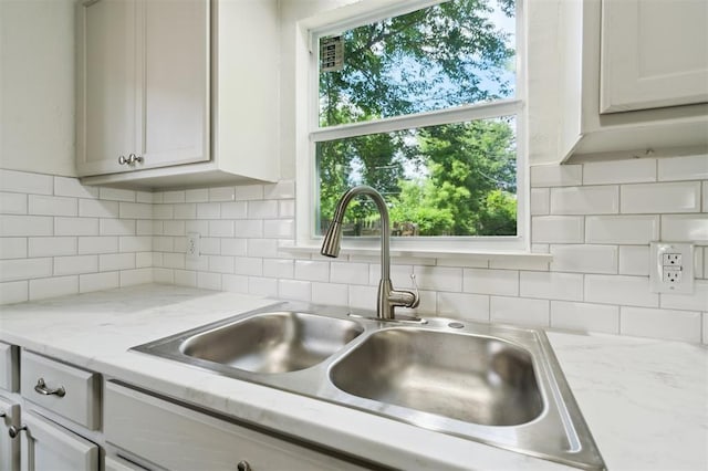 2233 SW 40th St, Oklahoma City, OK 73119 - kitchen featuring a sink and decorative backsplash