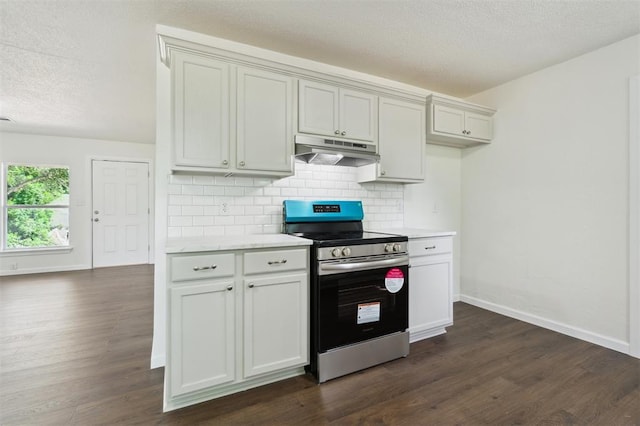 2233 SW 40th St, Oklahoma City, OK 73119 - kitchen with electric stove, under cabinet range hood, tasteful backsplash, light countertops, and a textured ceiling