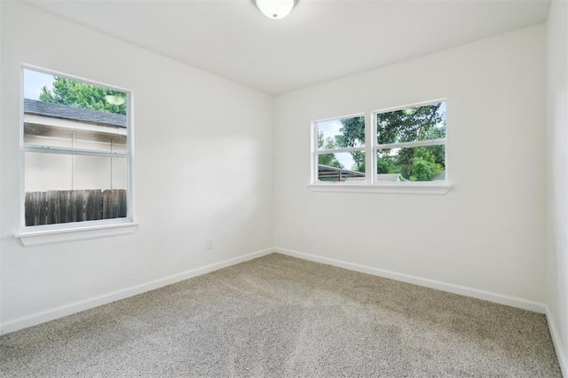 2233 SW 40th St, Oklahoma City, OK 73119 - carpeted empty room featuring baseboards