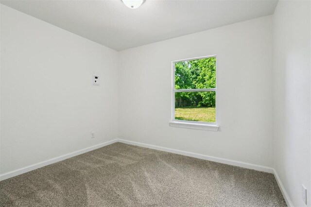 2233 SW 40th St, Oklahoma City, OK 73119 - unfurnished room featuring carpet floors and baseboards