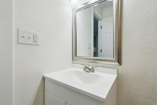 2233 SW 40th St, Oklahoma City, OK 73119 - bathroom with vanity and a textured wall