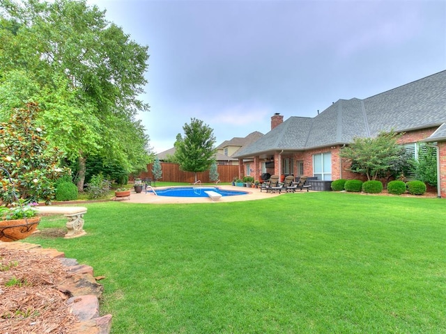 view of yard featuring a fenced backyard, a patio, and a fenced in pool