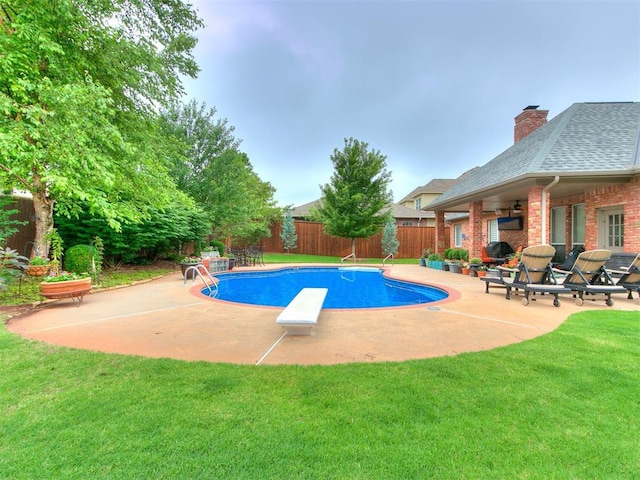 view of pool featuring a fenced backyard, a lawn, a patio area, and a fenced in pool