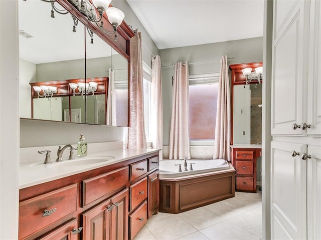 full bath with tile patterned flooring, vanity, a bath, and visible vents