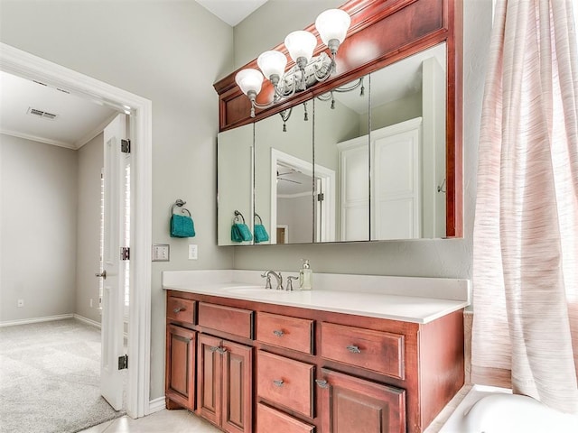 bathroom with baseboards, visible vents, and vanity