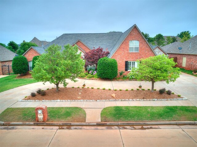 view of front of home featuring concrete driveway and a shingled roof
