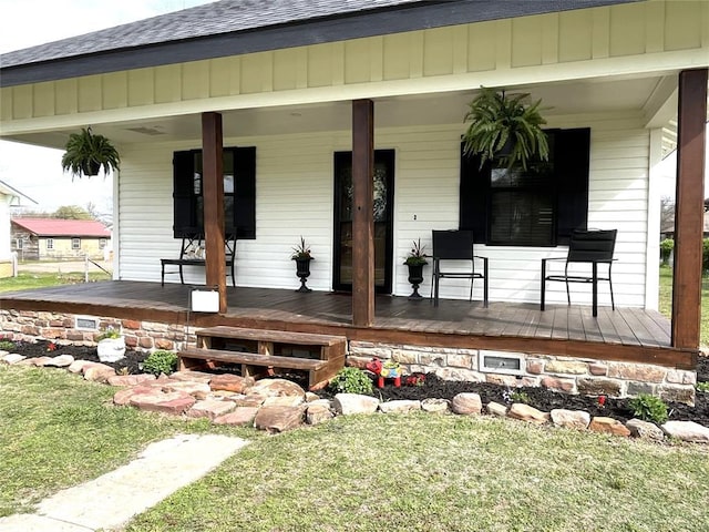 doorway to property featuring covered porch
