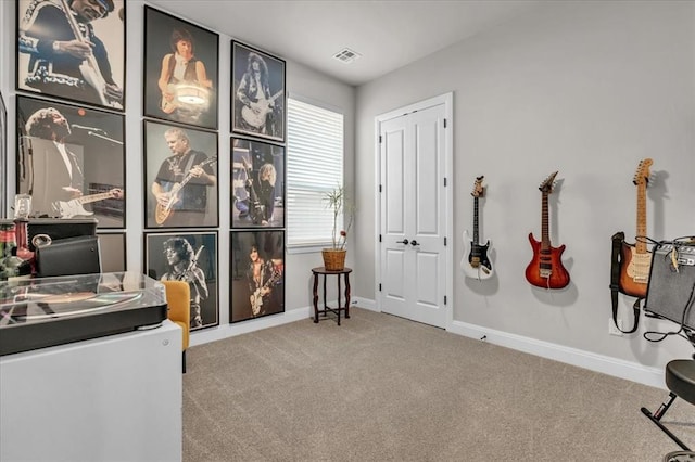 carpeted home office with baseboards