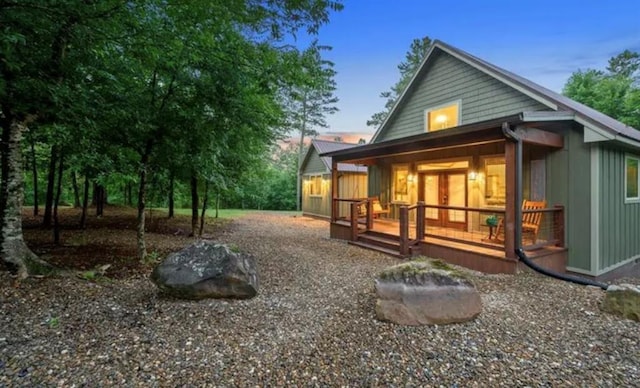 back of property featuring board and batten siding