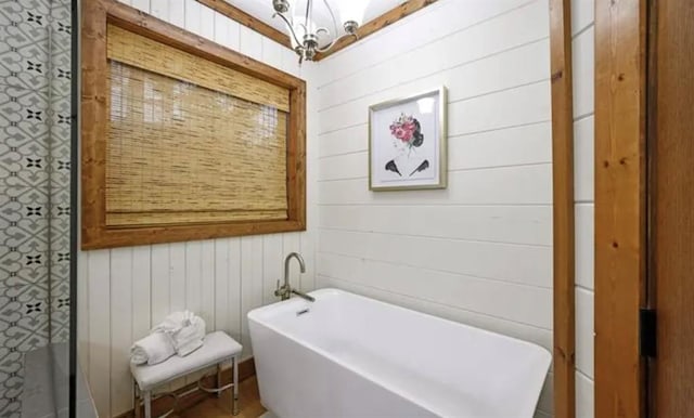 bathroom with a freestanding tub