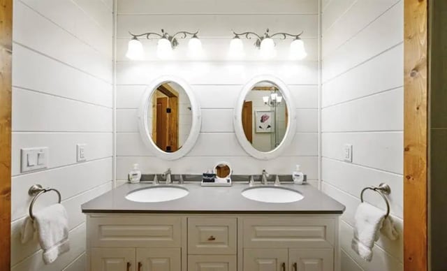 full bath with double vanity and a sink