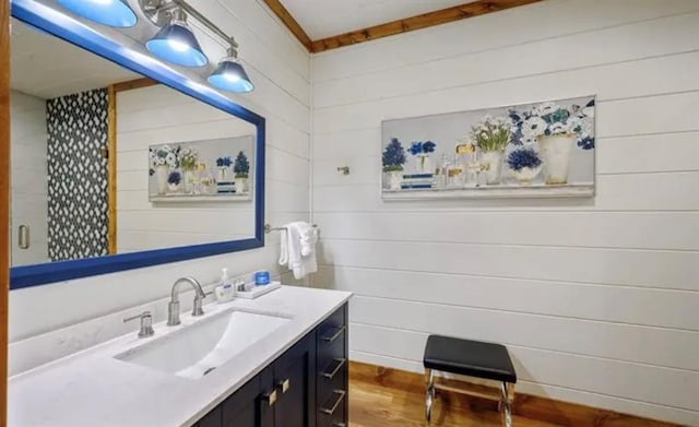 bathroom with vanity and wood finished floors