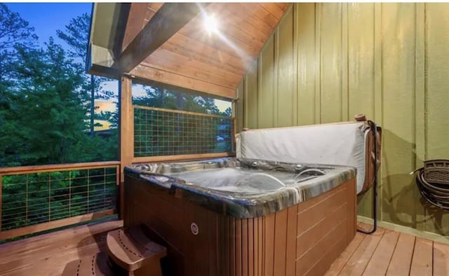 wooden terrace featuring a hot tub