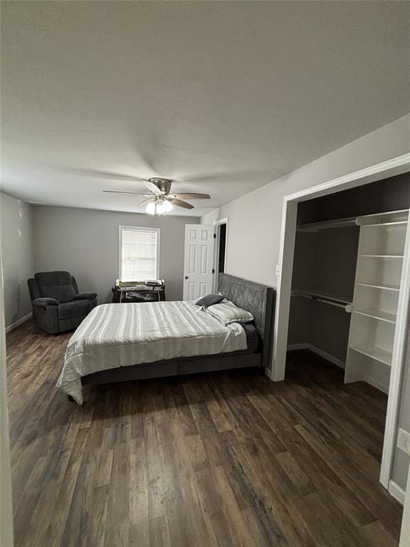 bedroom featuring dark wood-type flooring and ceiling fan