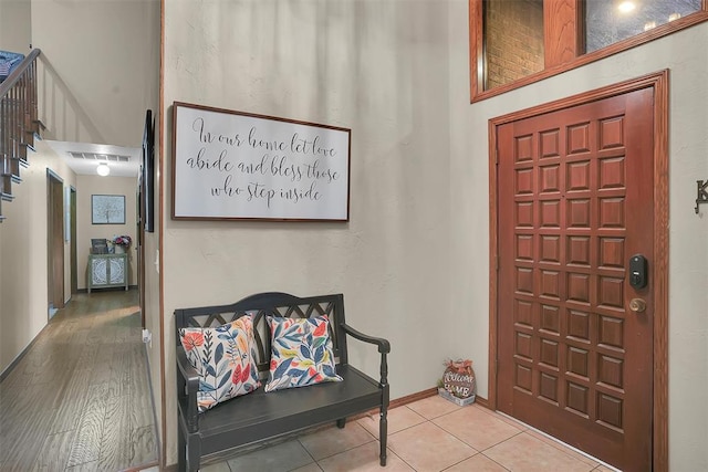 foyer entrance featuring visible vents and tile patterned flooring
