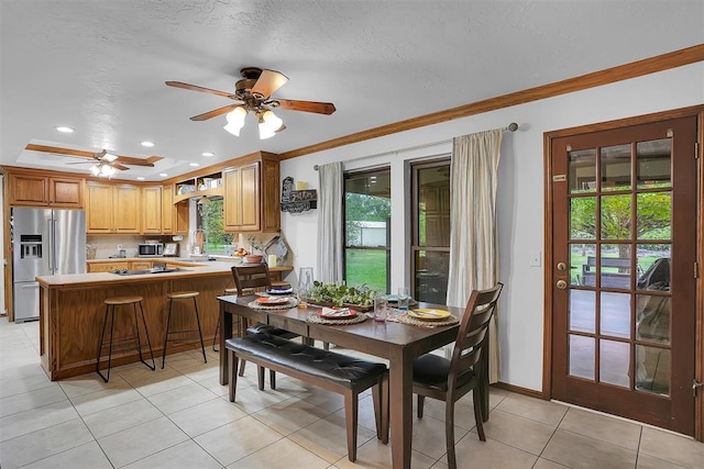dining room with crown molding, light tile patterned floors, ceiling fan, baseboards, and recessed lighting
