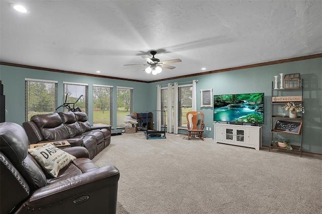 carpeted living room with ceiling fan, recessed lighting, and ornamental molding