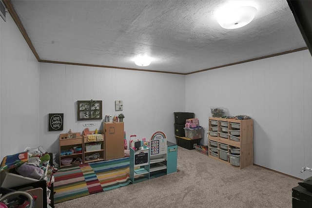 game room featuring carpet floors, crown molding, and a textured ceiling