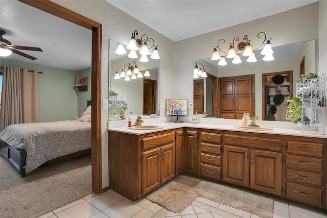full bathroom featuring tile patterned floors, a ceiling fan, a sink, and double vanity
