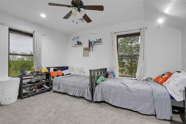 carpeted bedroom with vaulted ceiling, a ceiling fan, and recessed lighting
