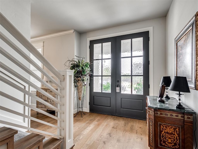 1924 Plaza District Dr, Edmond, OK 73034 - entryway with stairs, french doors, and light wood-type flooring