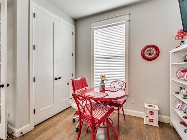 1924 Plaza District Dr, Edmond, OK 73034 - dining room featuring baseboards, light wood-style flooring, and a healthy amount of sunlight