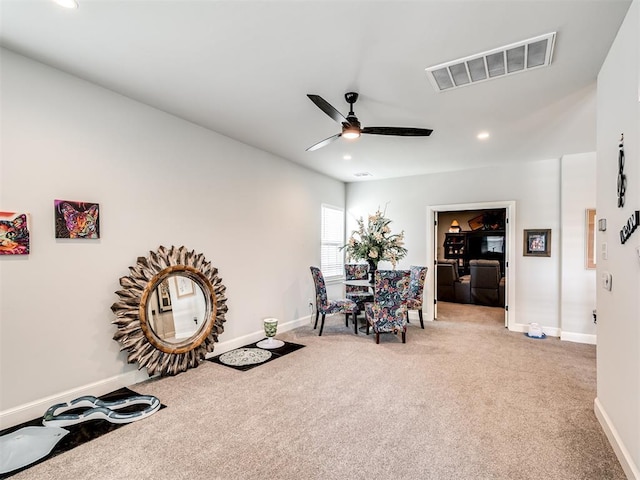 1924 Plaza District Dr, Edmond, OK 73034 - living area featuring carpet flooring, a ceiling fan, baseboards, and visible vents