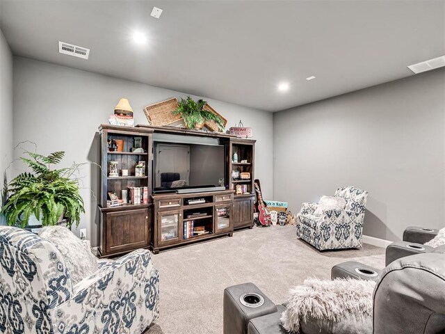 1924 Plaza District Dr, Edmond, OK 73034 - living room featuring carpet flooring and visible vents