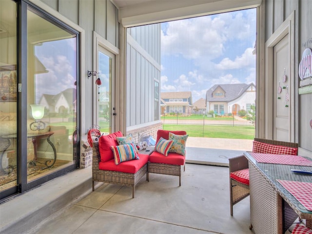 1924 Plaza District Dr, Edmond, OK 73034 - sunroom / solarium with concrete floors and a residential view