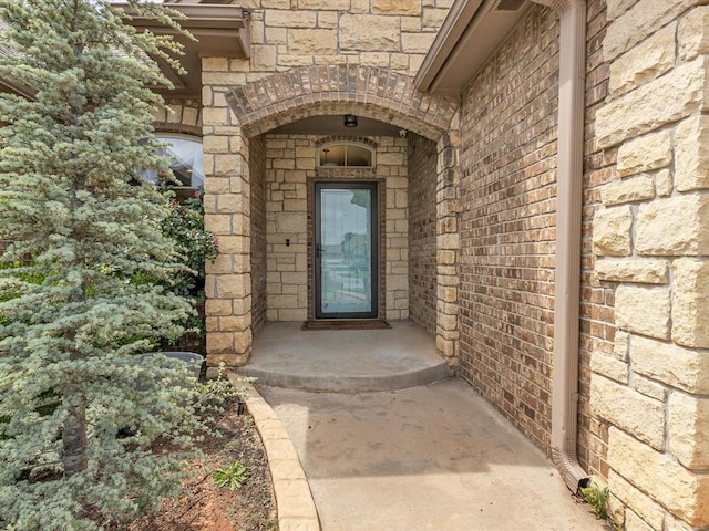 2809 Morgan Trace Rd, Yukon, OK 73099 - doorway to property featuring brick siding and stone siding