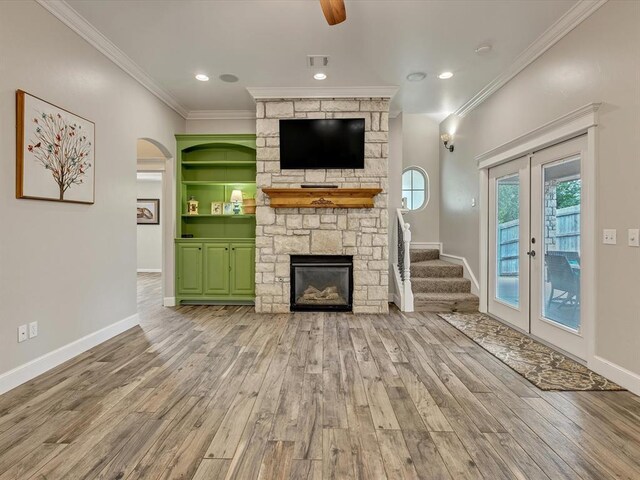 2809 Morgan Trace Rd, Yukon, OK 73099 - unfurnished living room with french doors, wood finished floors, ornamental molding, baseboards, and plenty of natural light