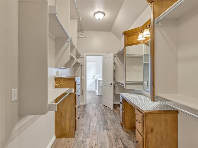 2809 Morgan Trace Rd, Yukon, OK 73099 - spacious closet featuring light wood finished floors and lofted ceiling