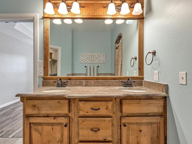 2809 Morgan Trace Rd, Yukon, OK 73099 - bathroom with double vanity and wood finished floors