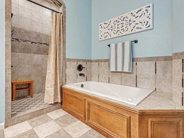 2809 Morgan Trace Rd, Yukon, OK 73099 - bathroom featuring a bath and a tile shower